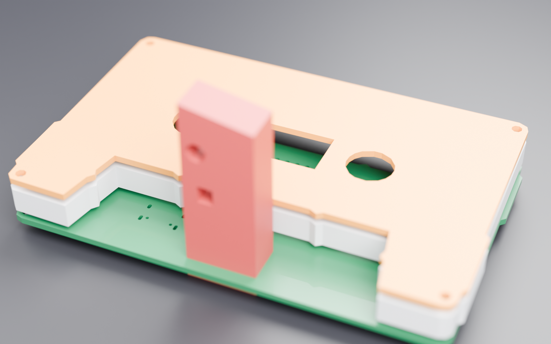 The exploded stack: the cassette-face panel on top, the routed board under it, the printed spacer frame between them, and the head insert standing up through the middle